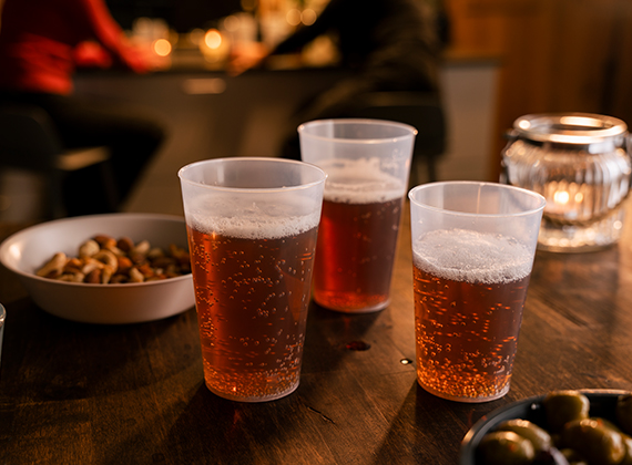 Reusable beer pint glasses on a pub table