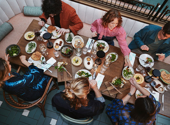 Group of friends enjoying dinner in a restaurant